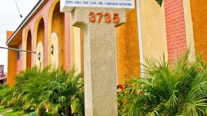 A sign for the Diamond Inn, indicating it offers rooms, Jacuzzi, King Bed, and Two Bed. The address is 3735.