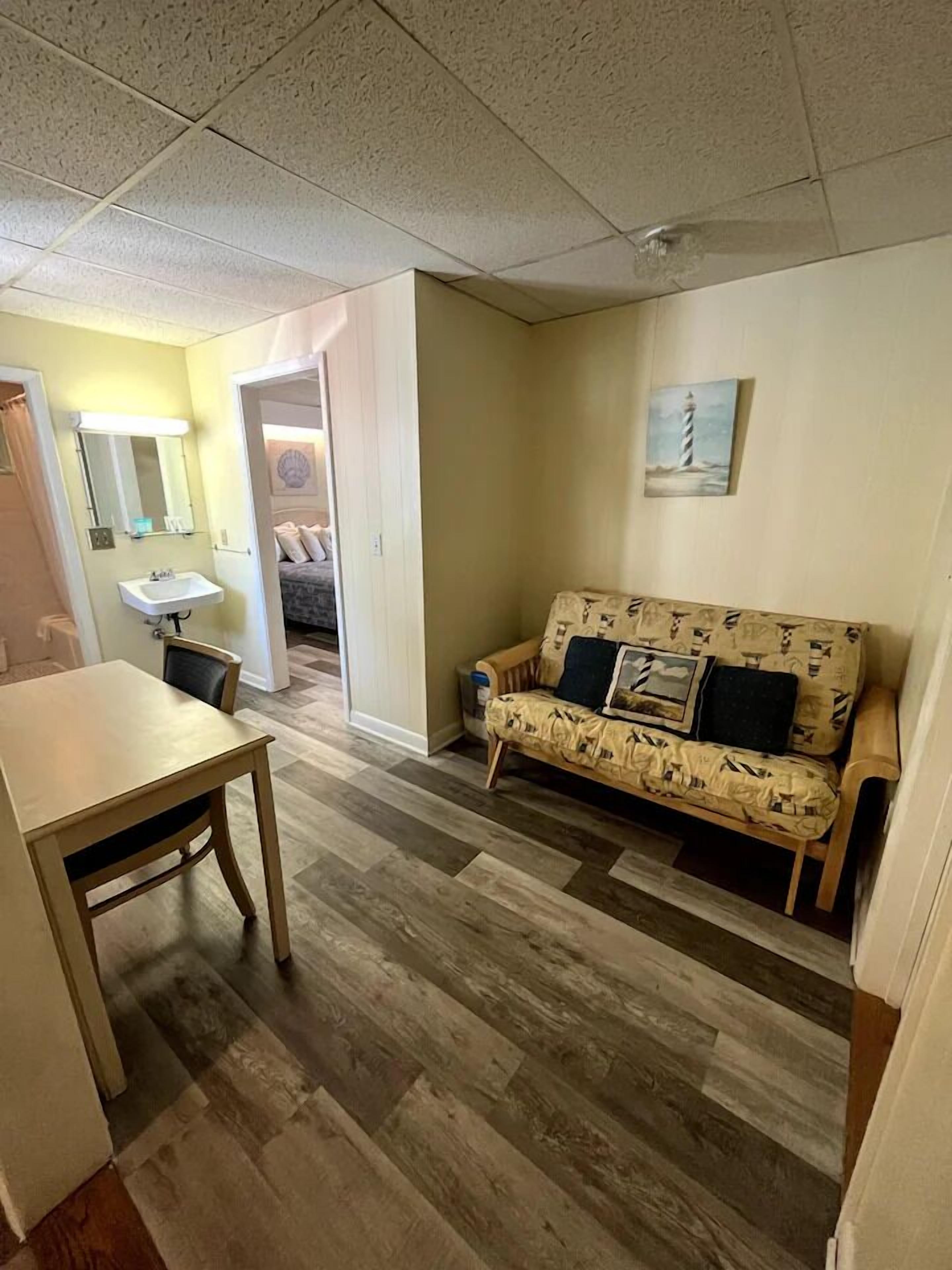 Main Building Queen, Futon, Kitchenette | Living area | TV