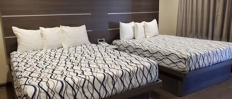 Room, 2 Queen Beds | Desk, blackout drapes, iron/ironing board, free WiFi