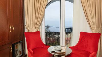 Suite, Sea View, Corner | Minibar, in-room safe, desk, blackout drapes