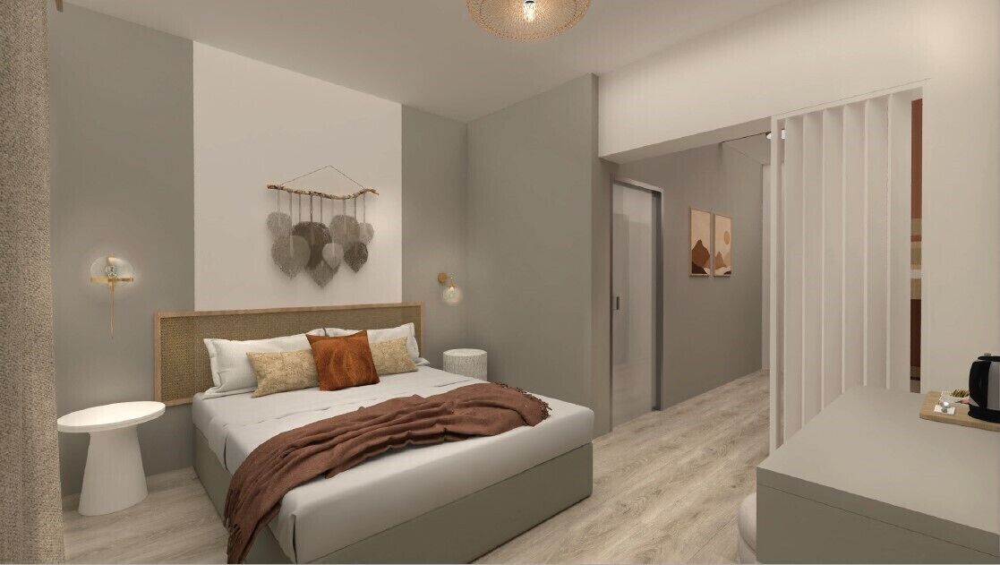 A modern bedroom with a large bed, bedside tables, a hanging light fixture, and a door leading to another room.