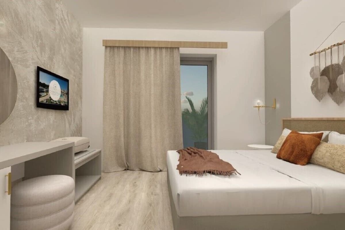 Quarto moderno com cama, penteadeira, espelho grande e vista para o exterior.