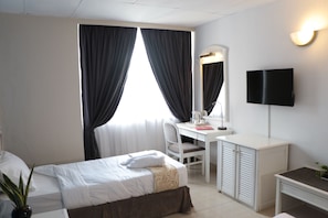 Standard Room, 2 Twin Beds | Desk, laptop workspace, iron/ironing board, free WiFi