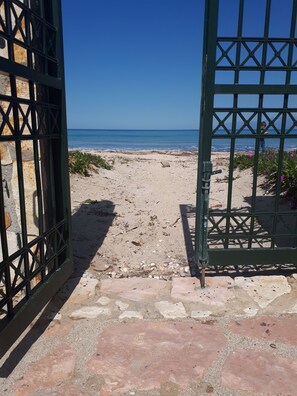 On the beach, sun-loungers, beach umbrellas