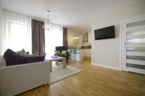 Apartment, 1 Double Bed with Sofa bed, Kitchenette, City View | Living room | Flat-screen TV