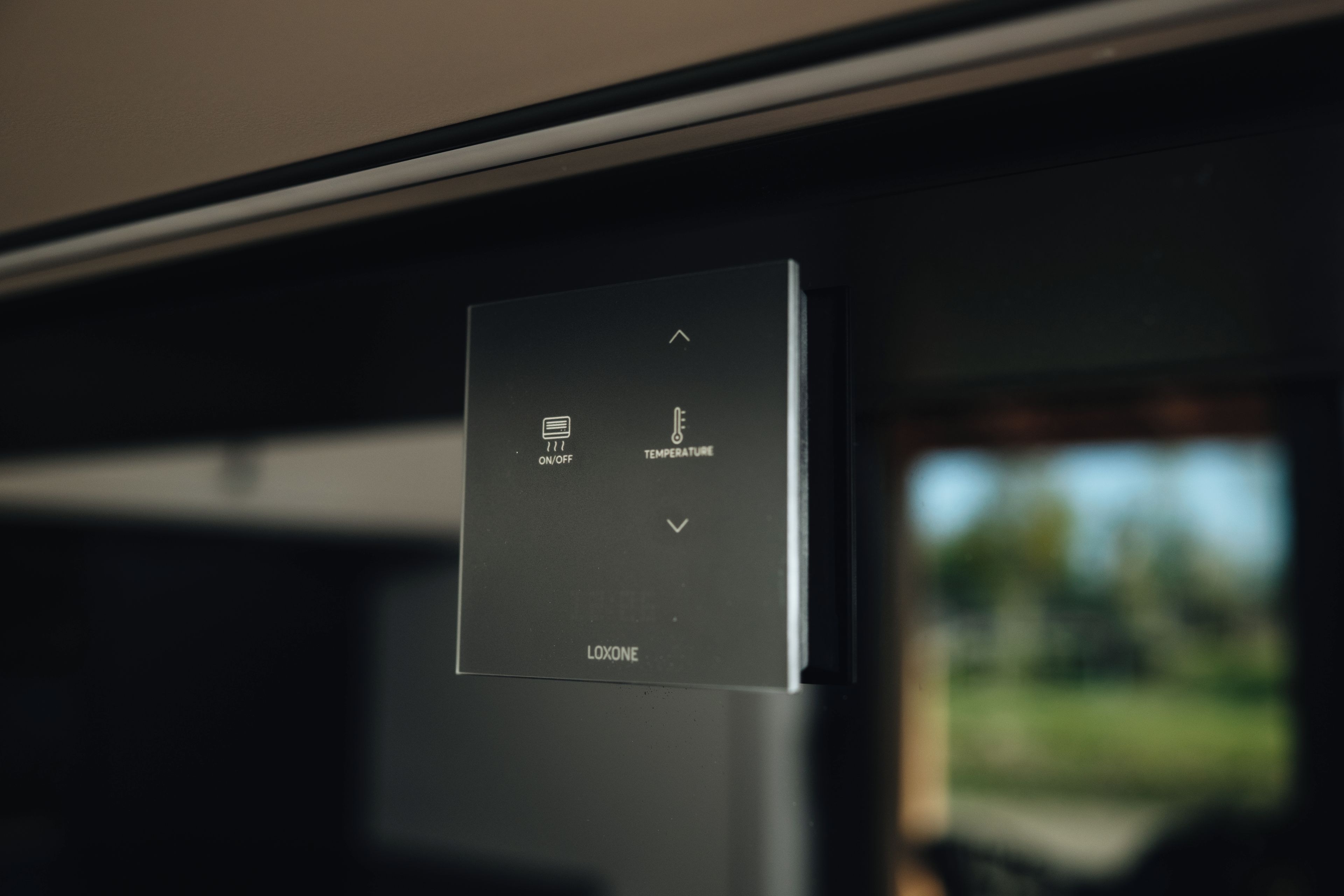 A control panel with temperature settings and a power switch.