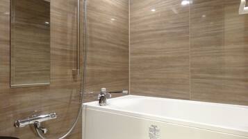Separate tub and shower, free toiletries, hair dryer, slippers