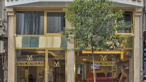 A hotel with a large sign reading "HOTEL METROLUX" and a visible entrance with a tree in front. - Metrolux Hotel (Istanbul)