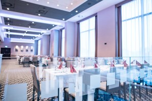 A spacious hotel dining area with tables set for guests, large windows, and a modern ceiling design. - Holiday Inn Dabrowa Gornicza by IHG (Dabrowa Gornicza)