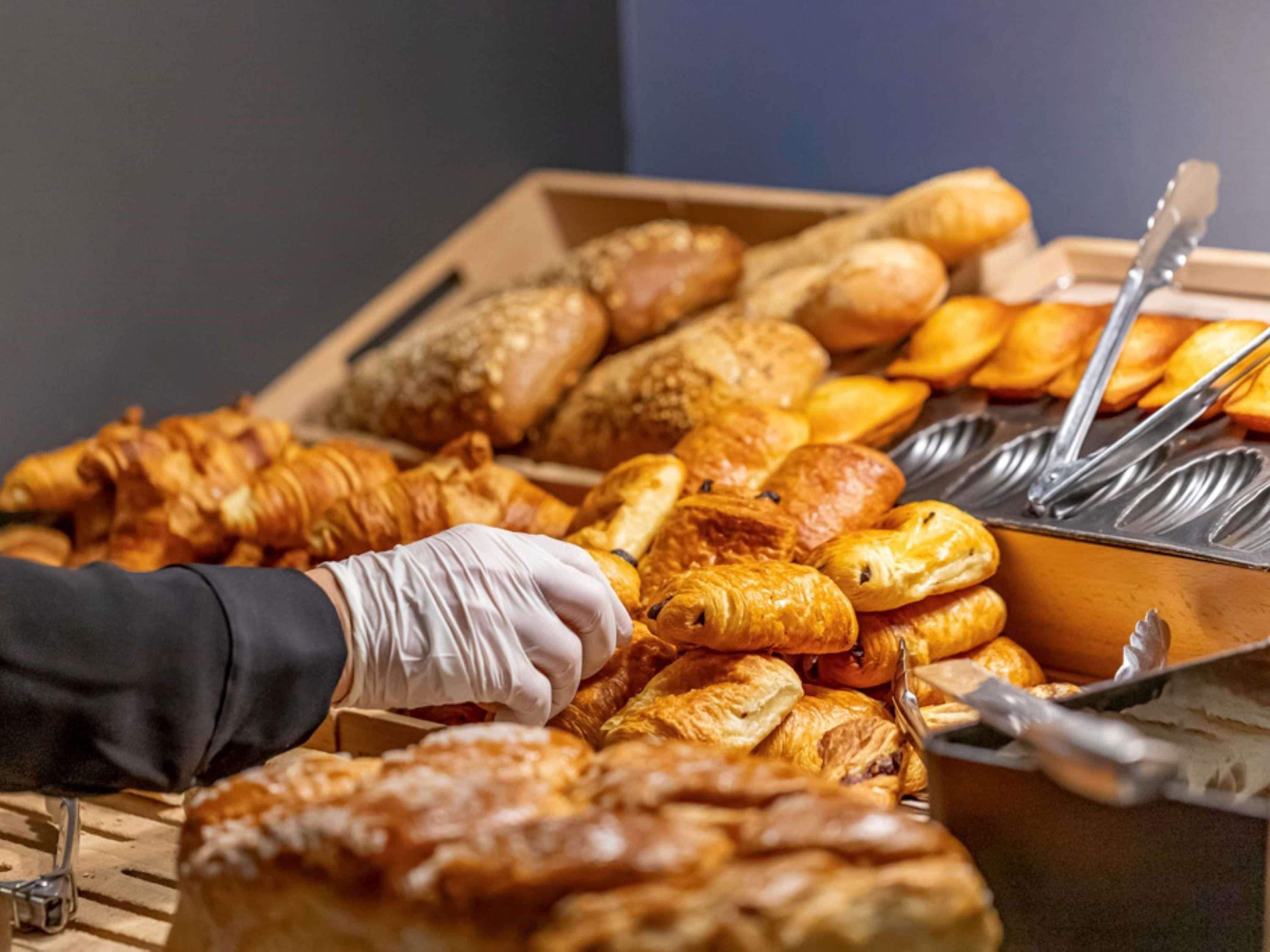 A variety of baked goods in a buffet setting.