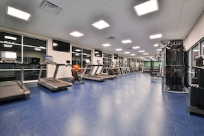 A gym with treadmills, stationary bikes, and weight machines. - Holiday Inn Express & Suites Madison by IHG (Madison)