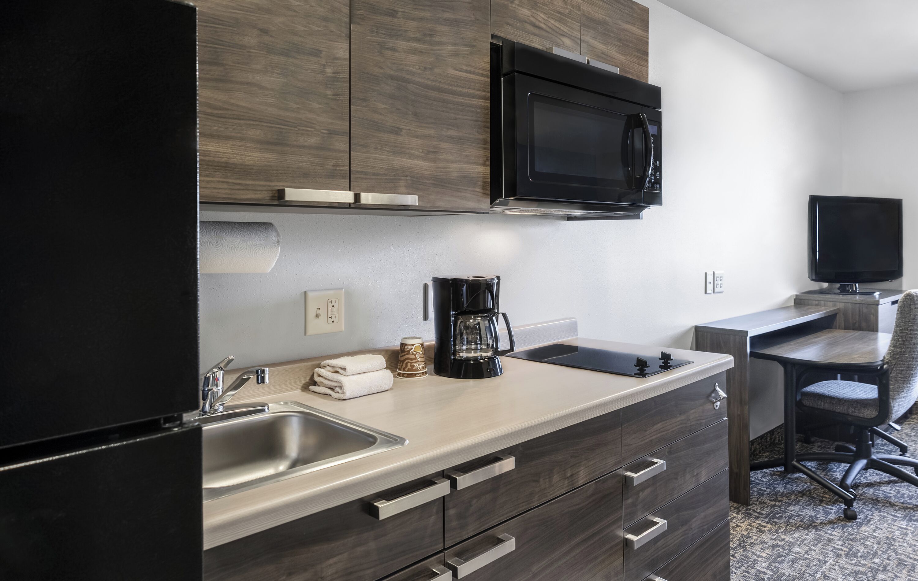 full-sized fridge, microwave, stovetop, coffee/tea maker