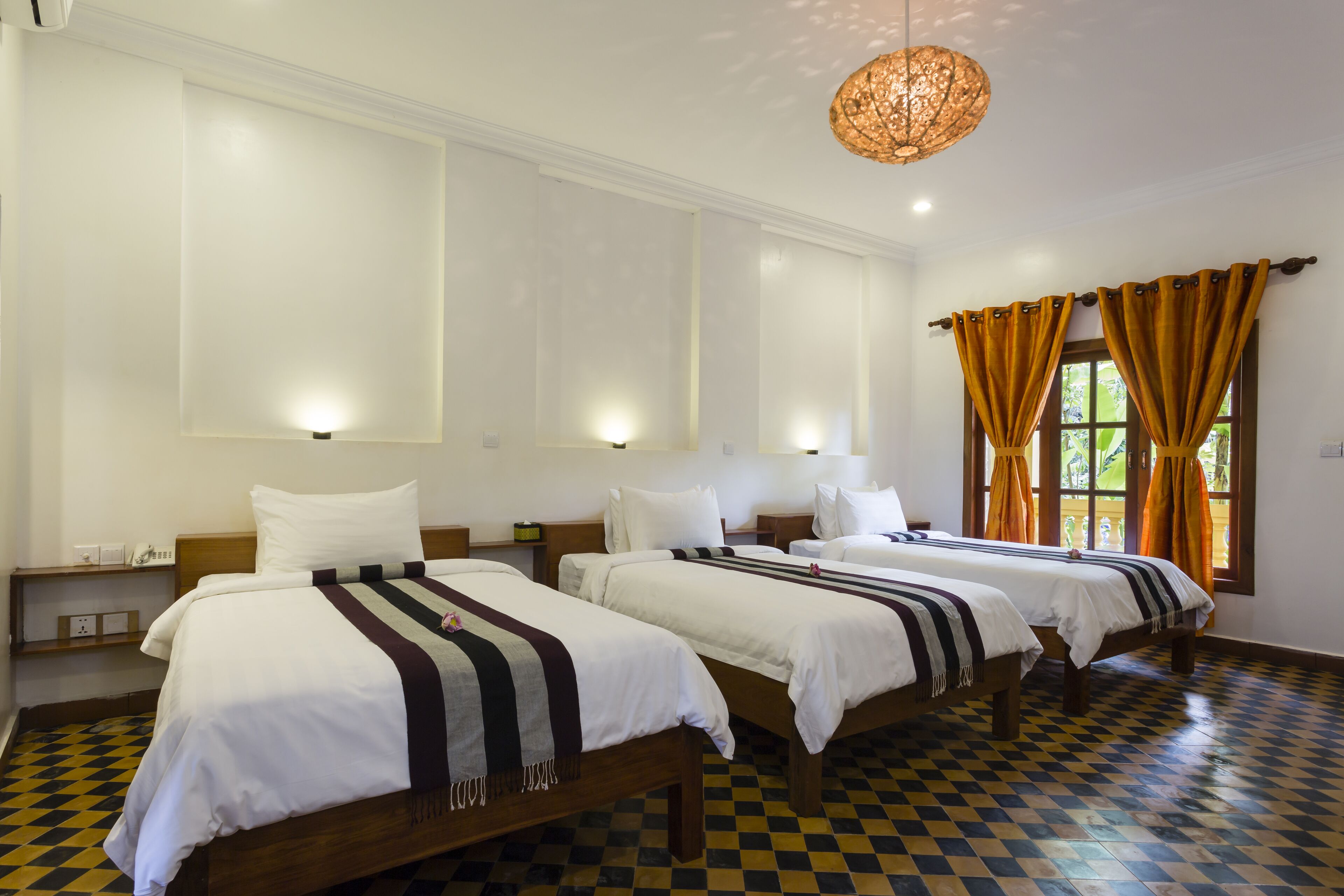 deluxe triple room, pool view | minibar, in-room safe, desk, free wifi