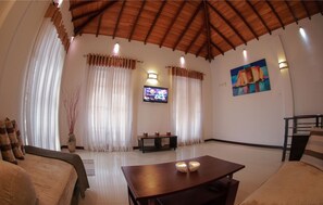 Apartemen (AC) | Area keluarga | TV layar datar