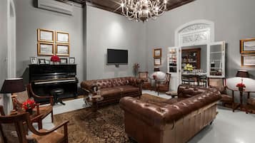 49-inch flat-screen TV with satellite channels, TV, books