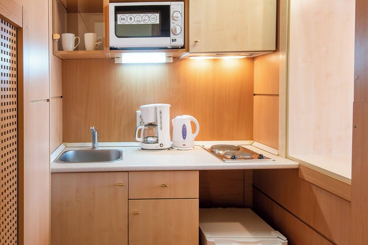 junior apartment, 1 queen bed with sofa bed, non smoking, city view | private kitchen | fridge