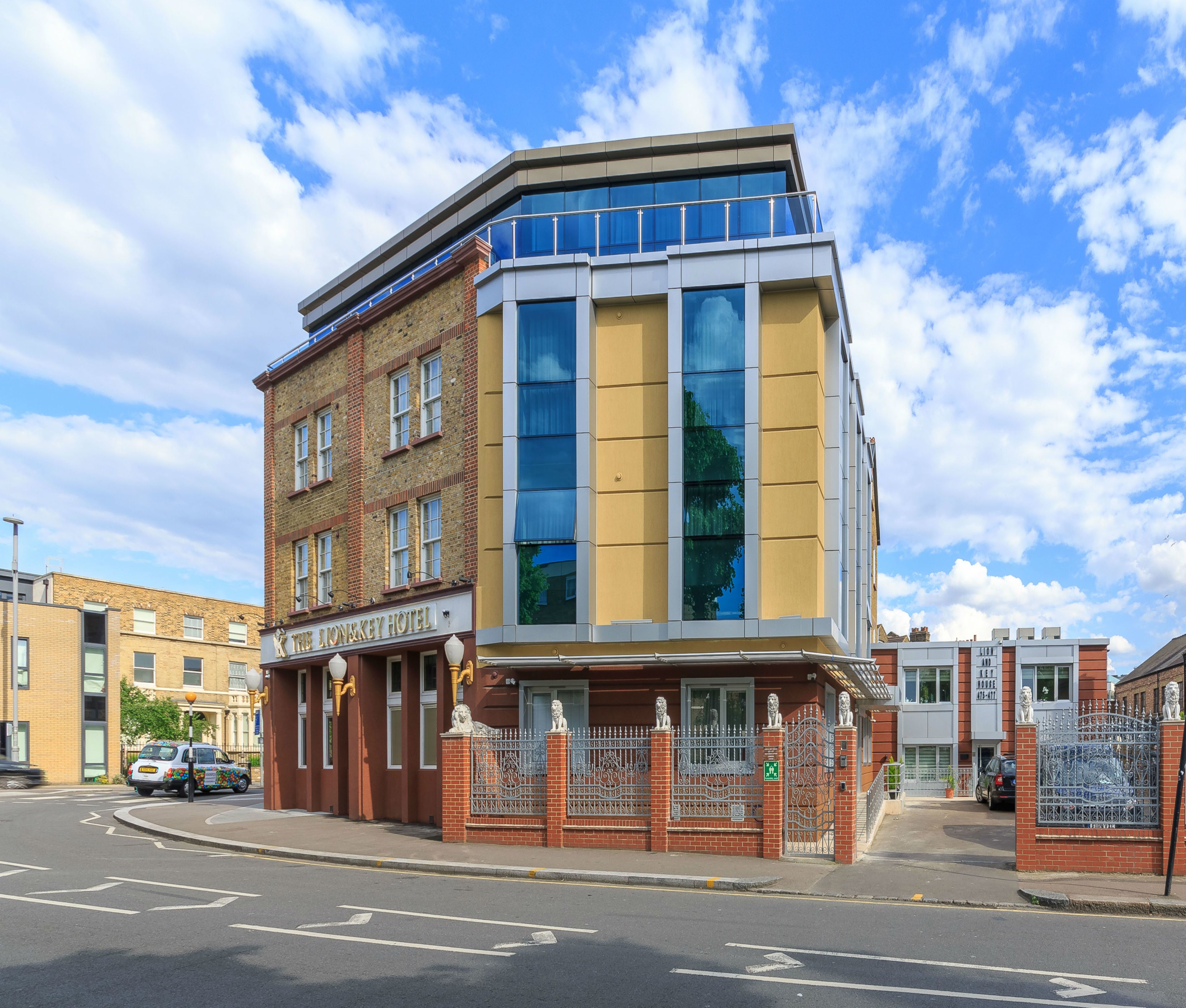 A corner building with a ground-floor shop and upper residential units.