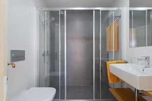 Shower, hair dryer, bathrobes, towels