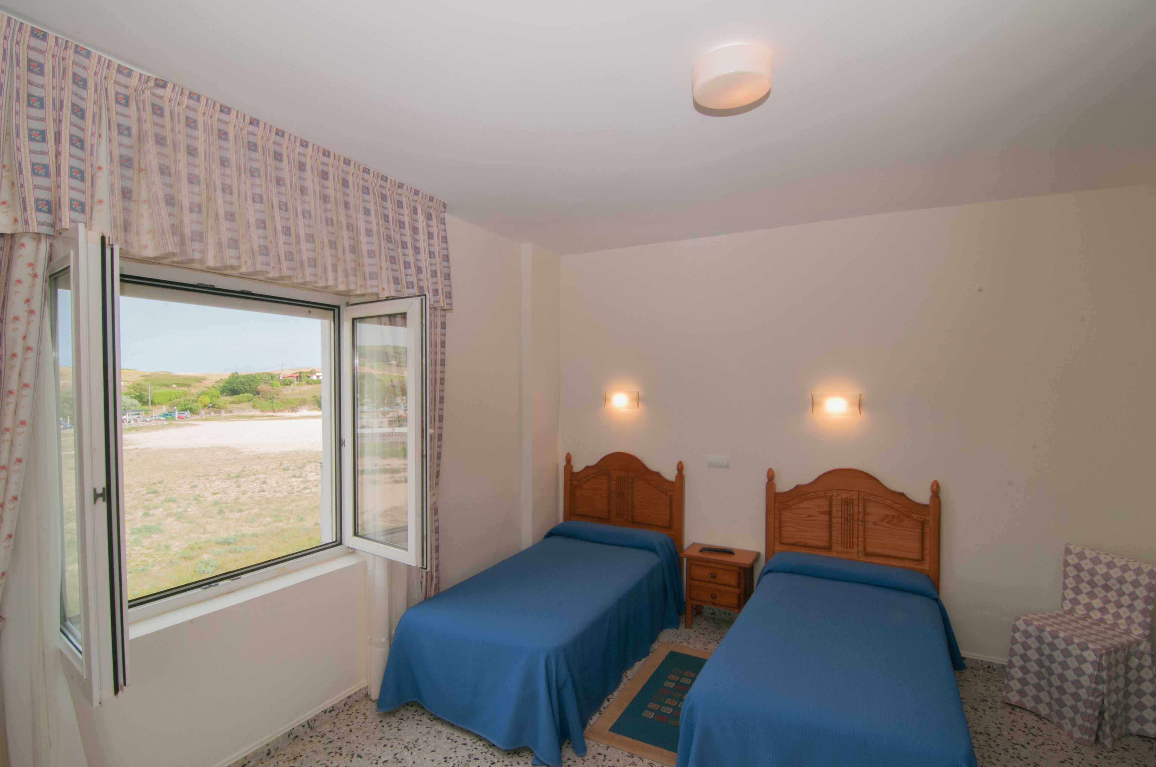 Economy Twin kamer, uitzicht op tuin | Beddengoed
