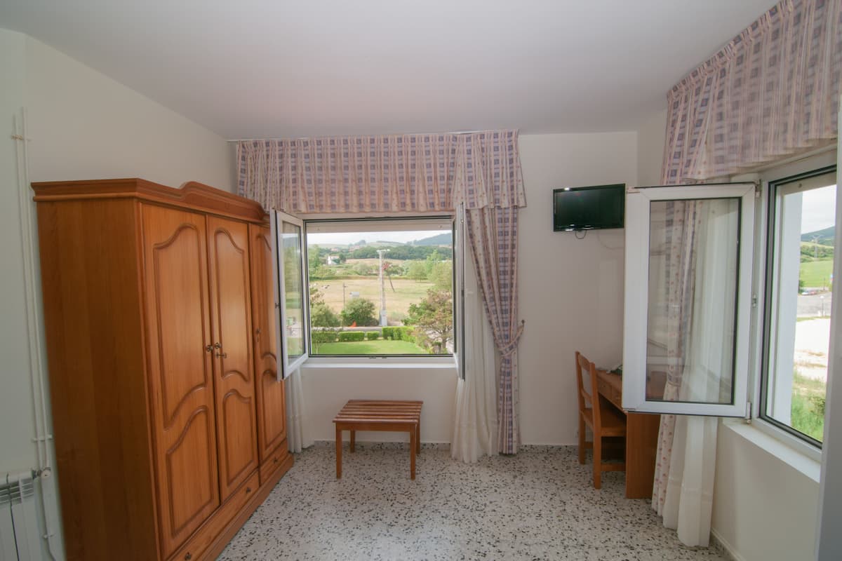 Economy Twin kamer, uitzicht op tuin | Beddengoed
