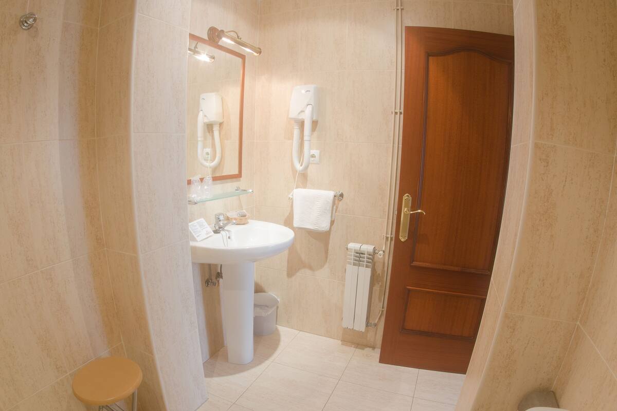 standard double room | bathroom | hair dryer, towels
