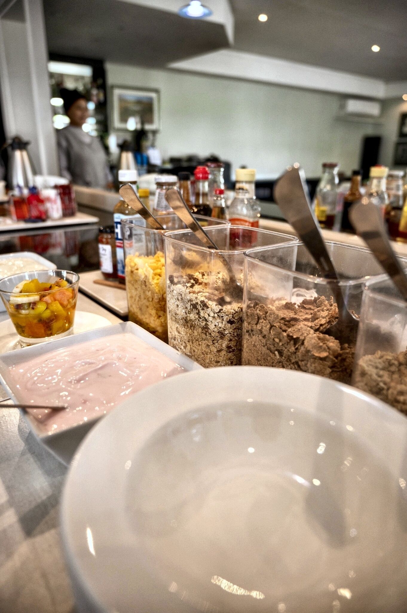 A kitchen counter with various food items and utensils.