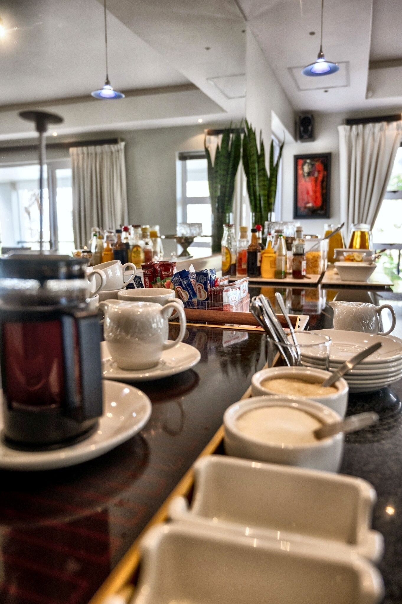 A breakfast buffet with various food items and beverages.