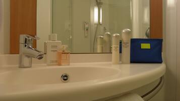 Shower, rainfall showerhead, hair dryer, towels