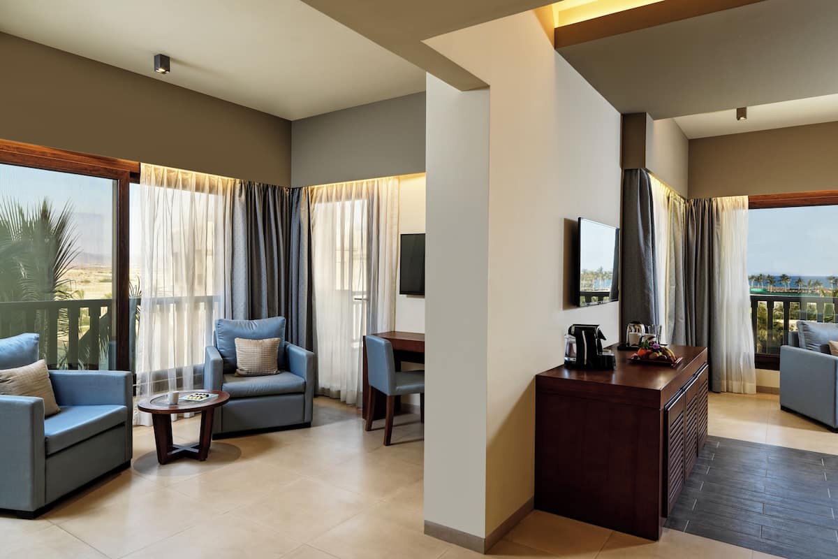 family room lagoon view with aqua park entrance | 1 bedroom, minibar, in-room safe, desk