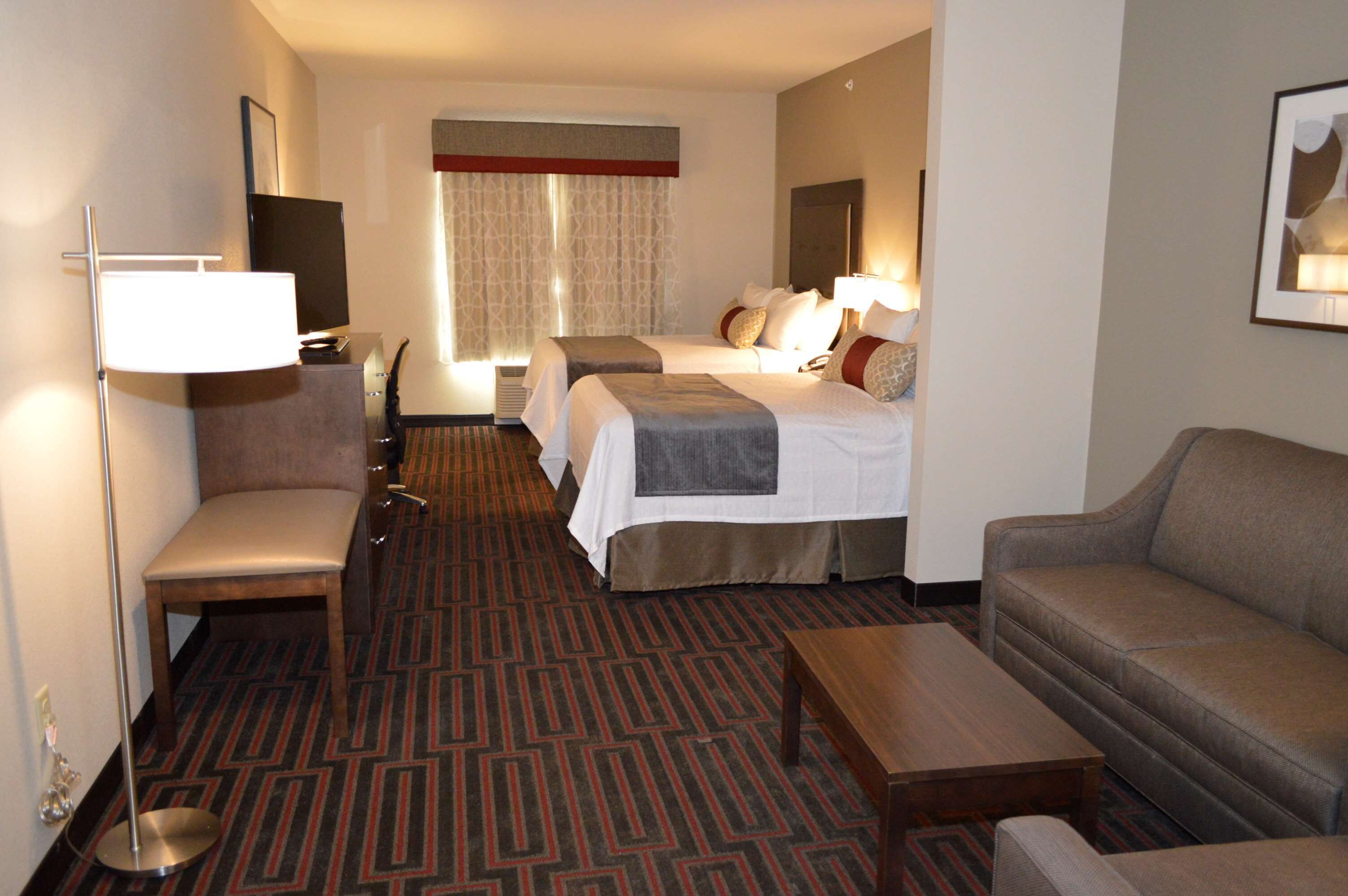 pillow-top beds, desk, laptop workspace, blackout curtains