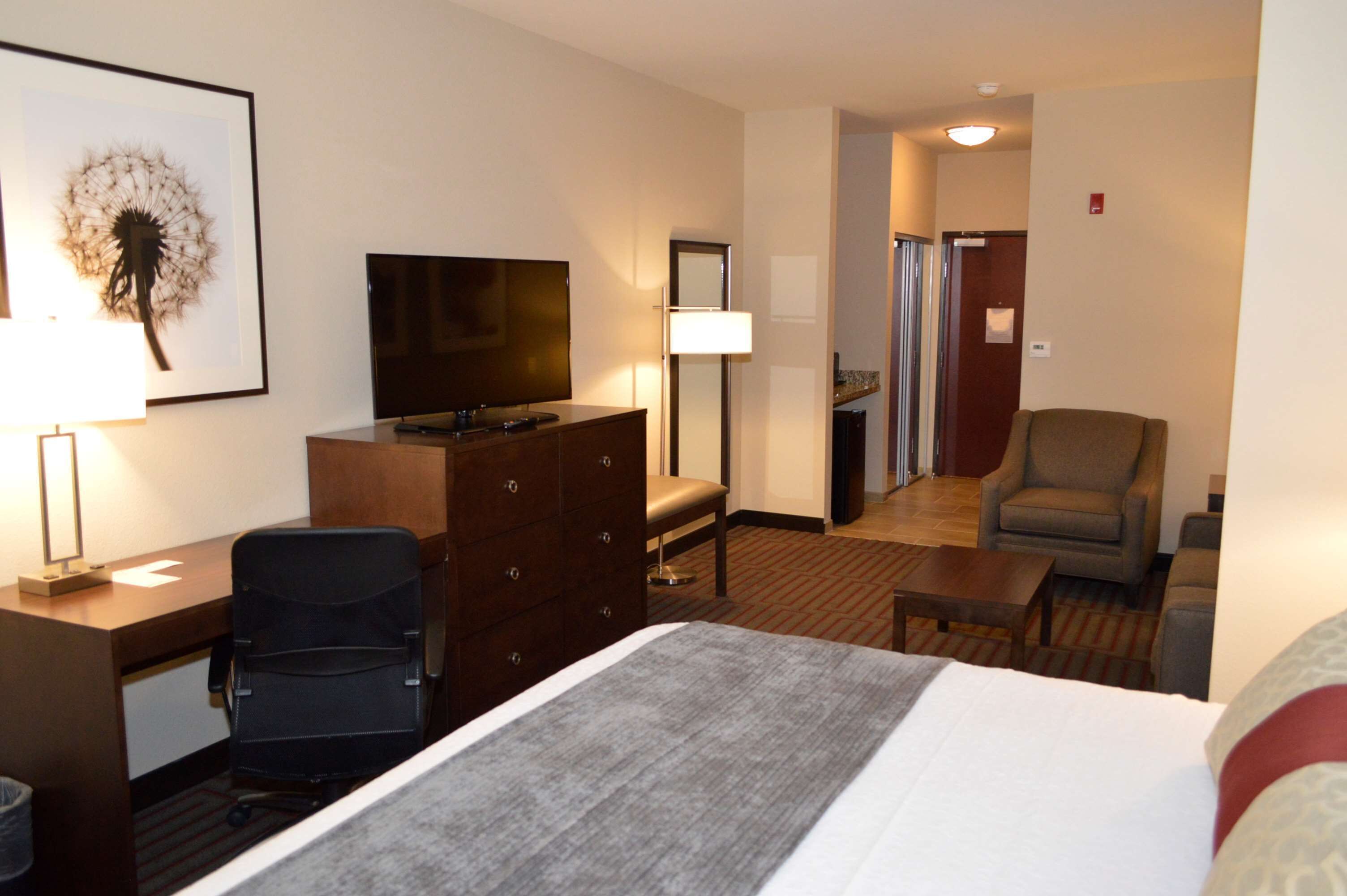 pillow-top beds, desk, laptop workspace, blackout curtains