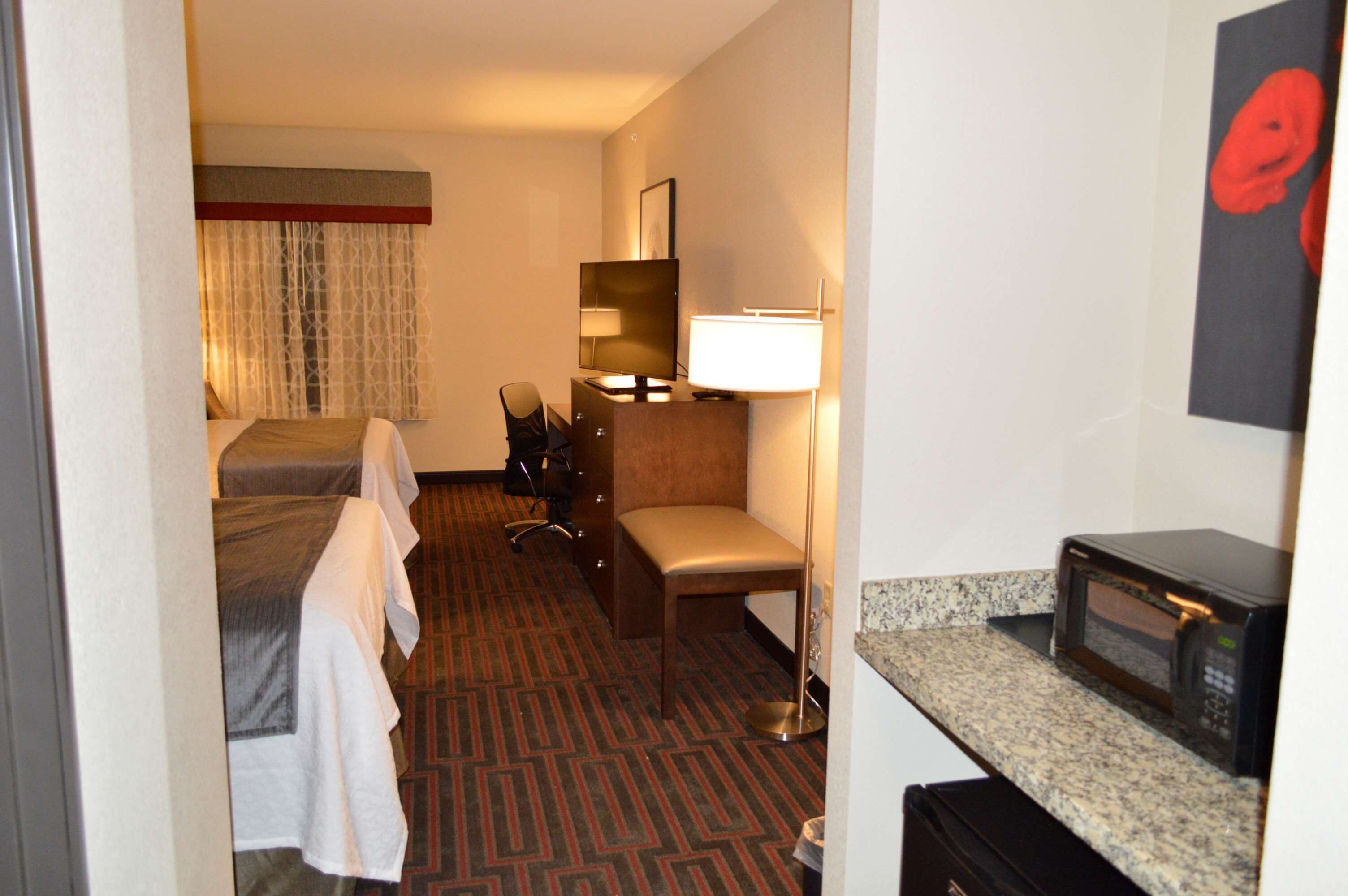 pillow-top beds, desk, laptop workspace, blackout curtains