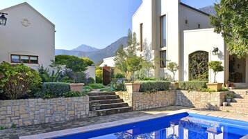 Outdoor pool, pool umbrellas, sun loungers