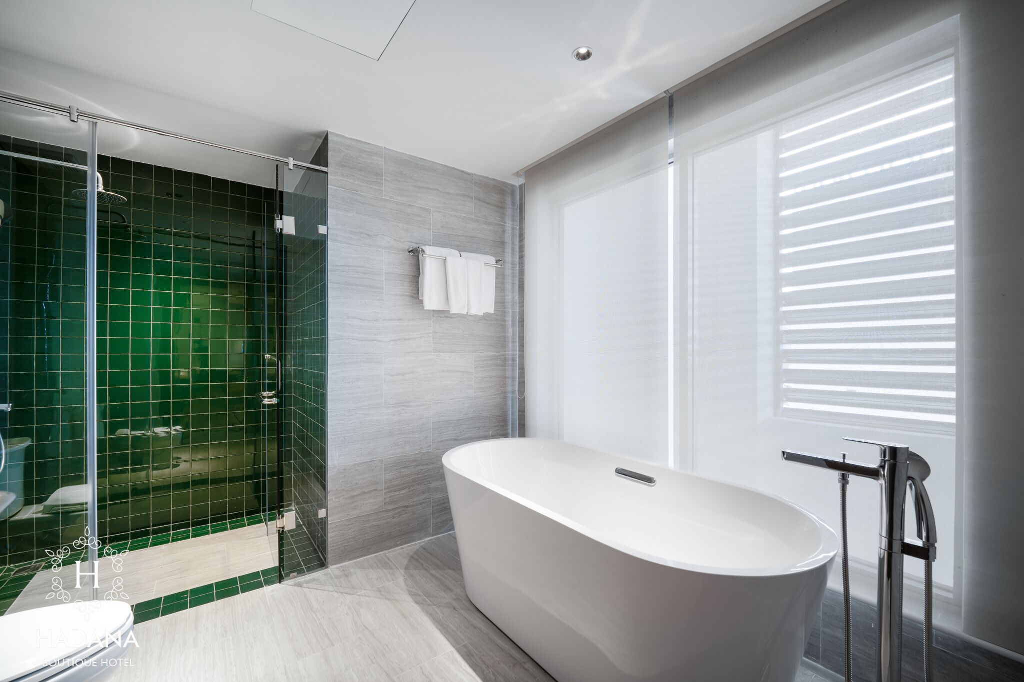 junior family suite | bathroom | hair dryer, bathrobes, slippers, towels