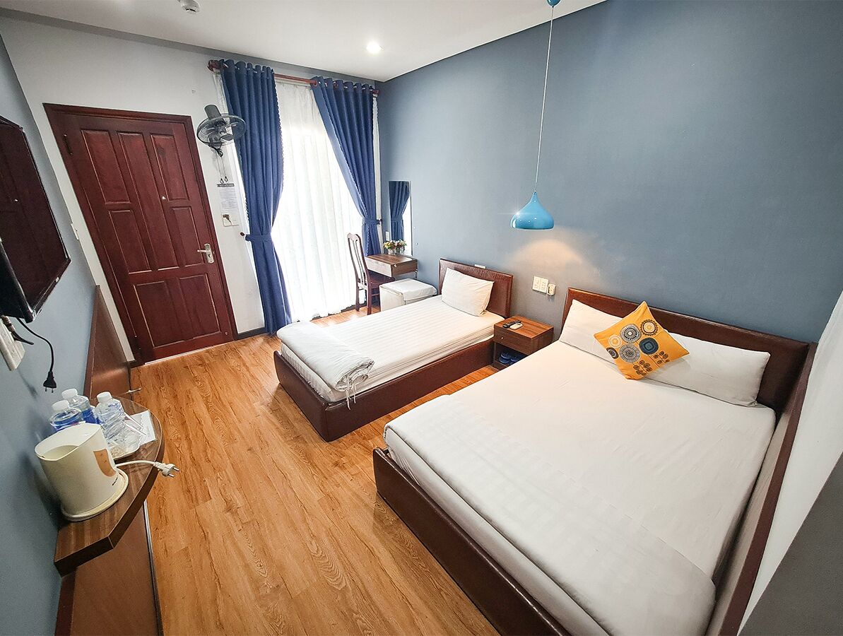 standard triple room, multiple beds, non smoking, garden view | minibar, in-room safe, desk, free wifi