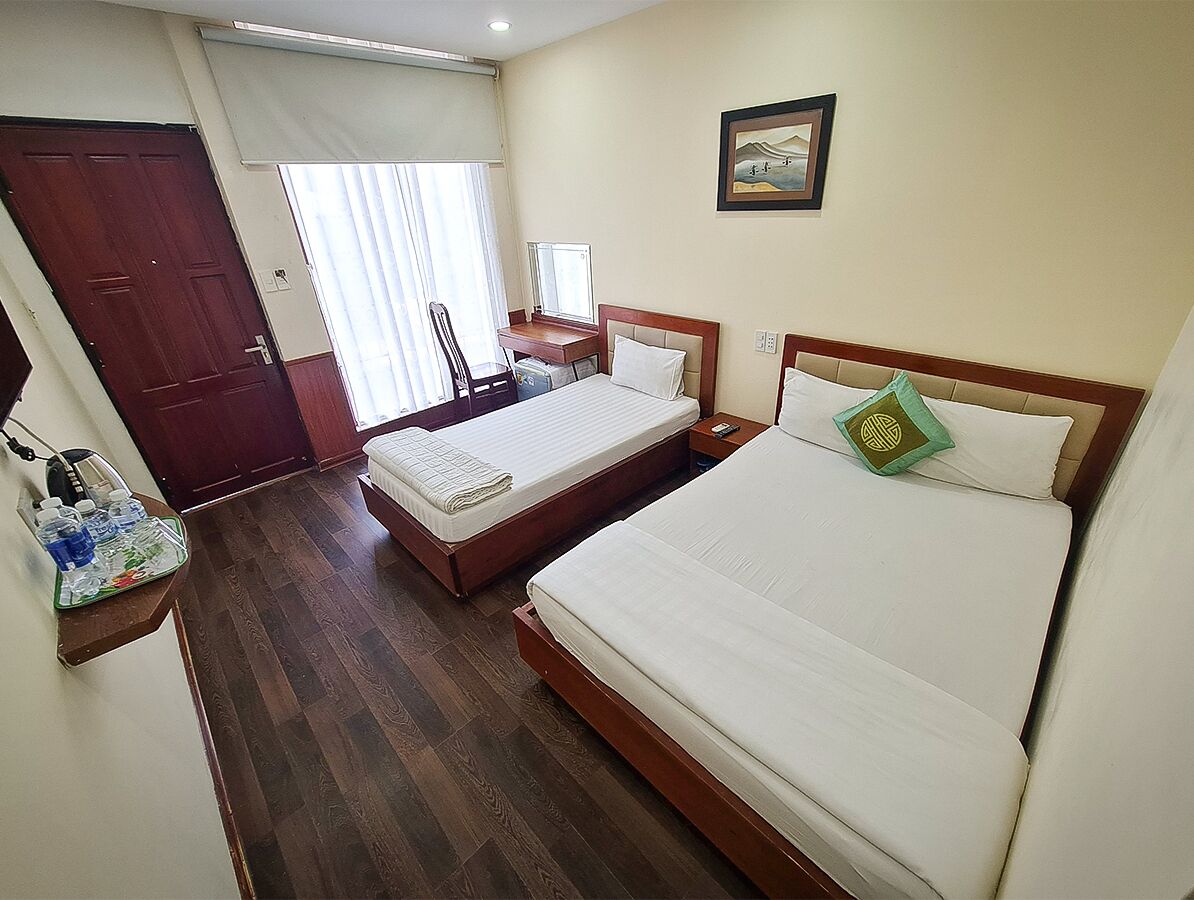 standard triple room, multiple beds, non smoking, garden view | minibar, in-room safe, desk, free wifi