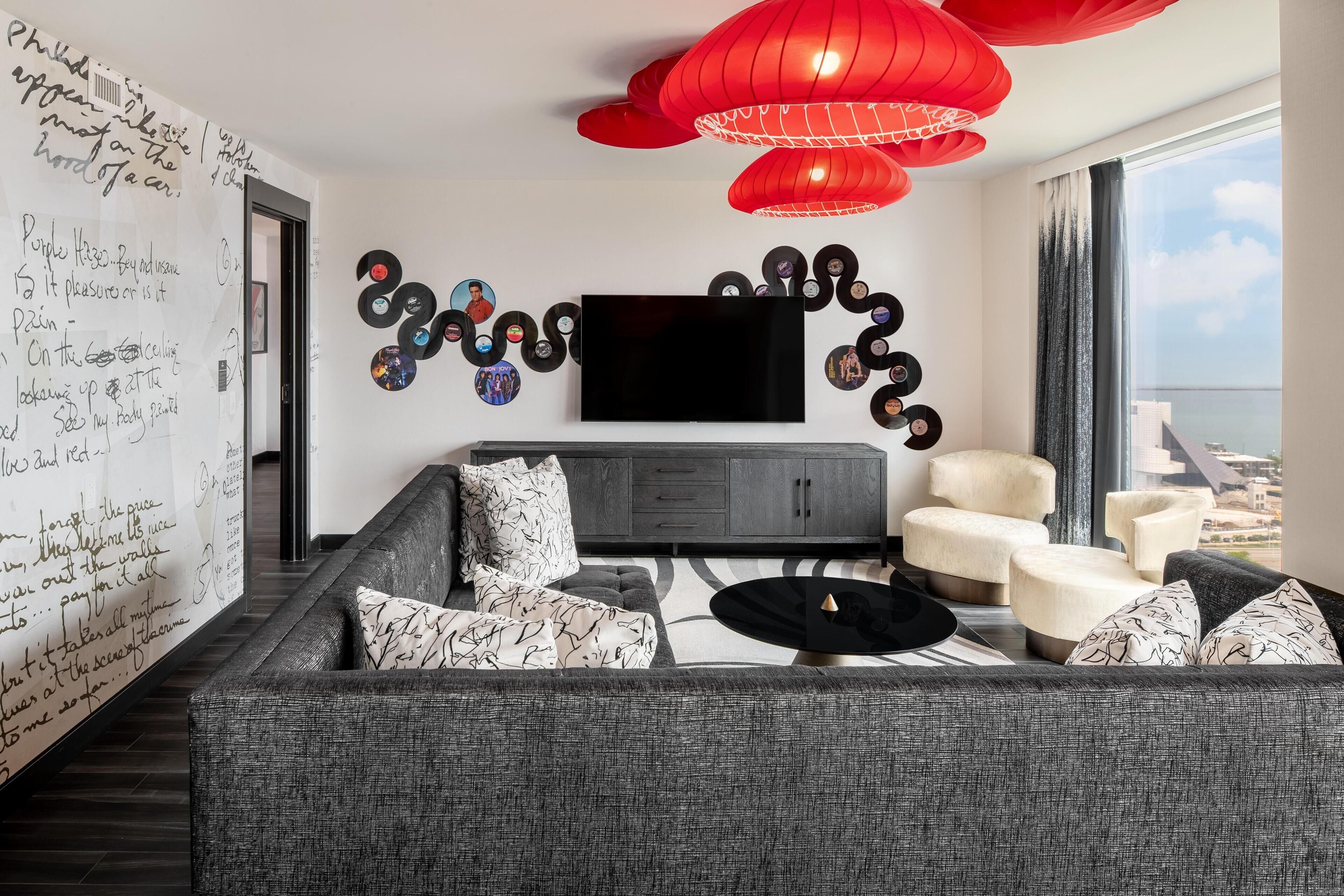 suite, 1 king bed, accessible (rock and roll w/roll in shwr) | living area | lcd tv, pay films