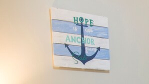 A wall-mounted sign with a nautical theme, featuring a large anchor and the text "HOPE is an anchor for my soul." - Madiolyn (Jeffreys Bay)