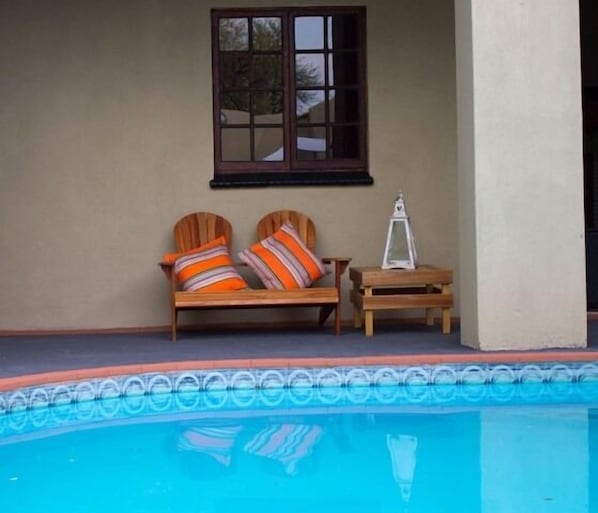 Outdoor pool, open 9:00 AM to 8:00 PM, pool loungers