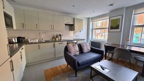 Apartment, 1 Bedroom | Living area | Flat-screen TV