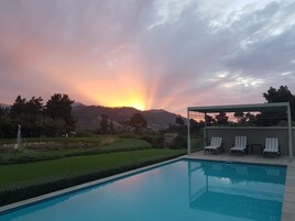 2 outdoor pools, pool umbrellas, pool loungers