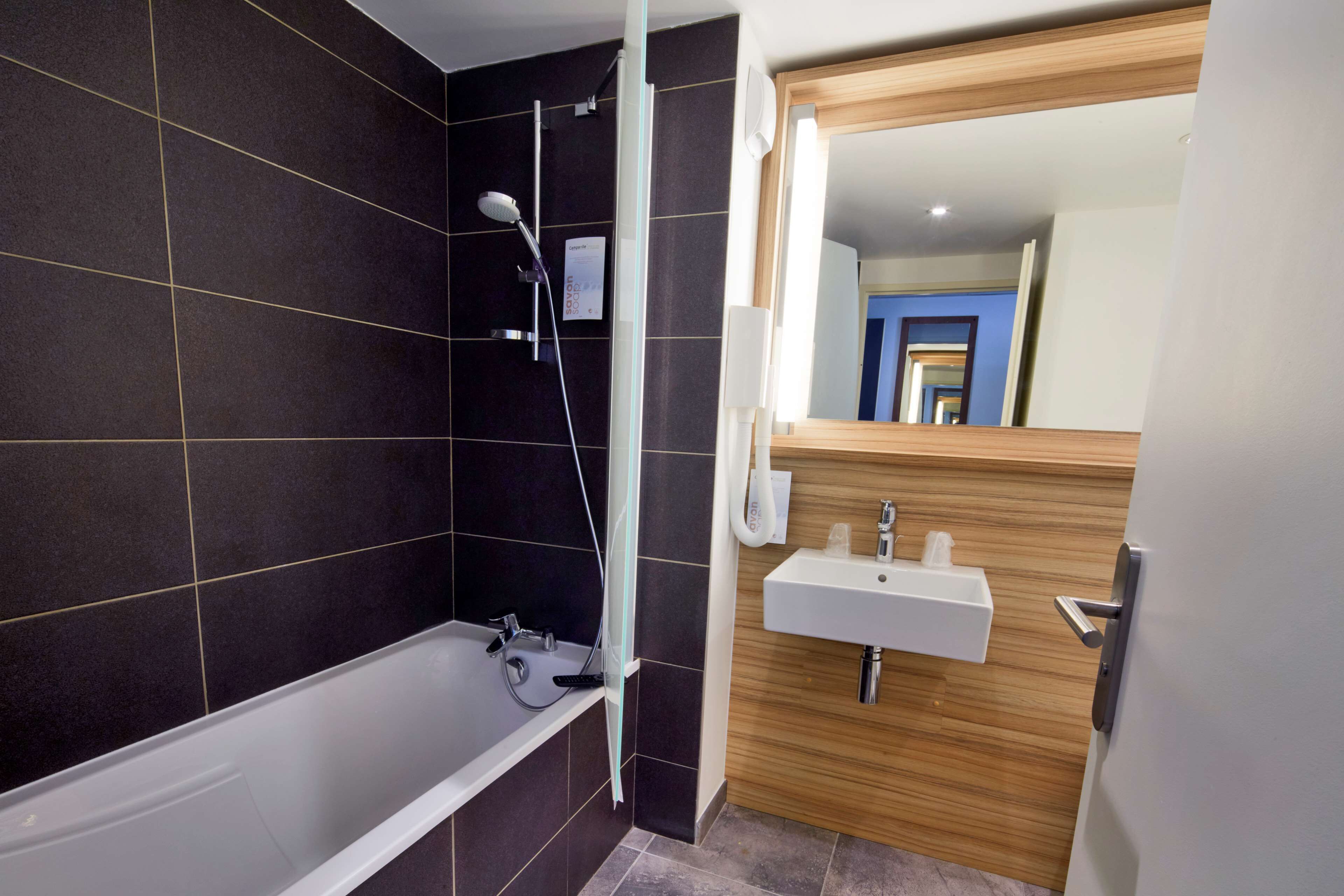 eco-friendly toiletries, hair dryer, towels, soap