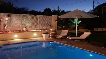 Seasonal outdoor pool, open 8:00 AM to 8:00 PM, pool umbrellas