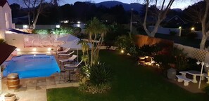 Seasonal outdoor pool, open 8:00 AM to 8:00 PM, pool umbrellas