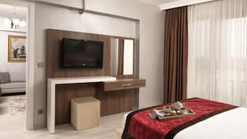 Superior suite, 1 slaapkamer, keuken | Luxe beddengoed, een minibar, een kluis op de kamer, een laptopwerkplek
