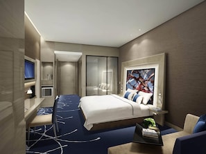 A modern hotel room with a bed, a desk, a TV, and a large abstract painting. - Novotel Ningbo East (Ningbo)