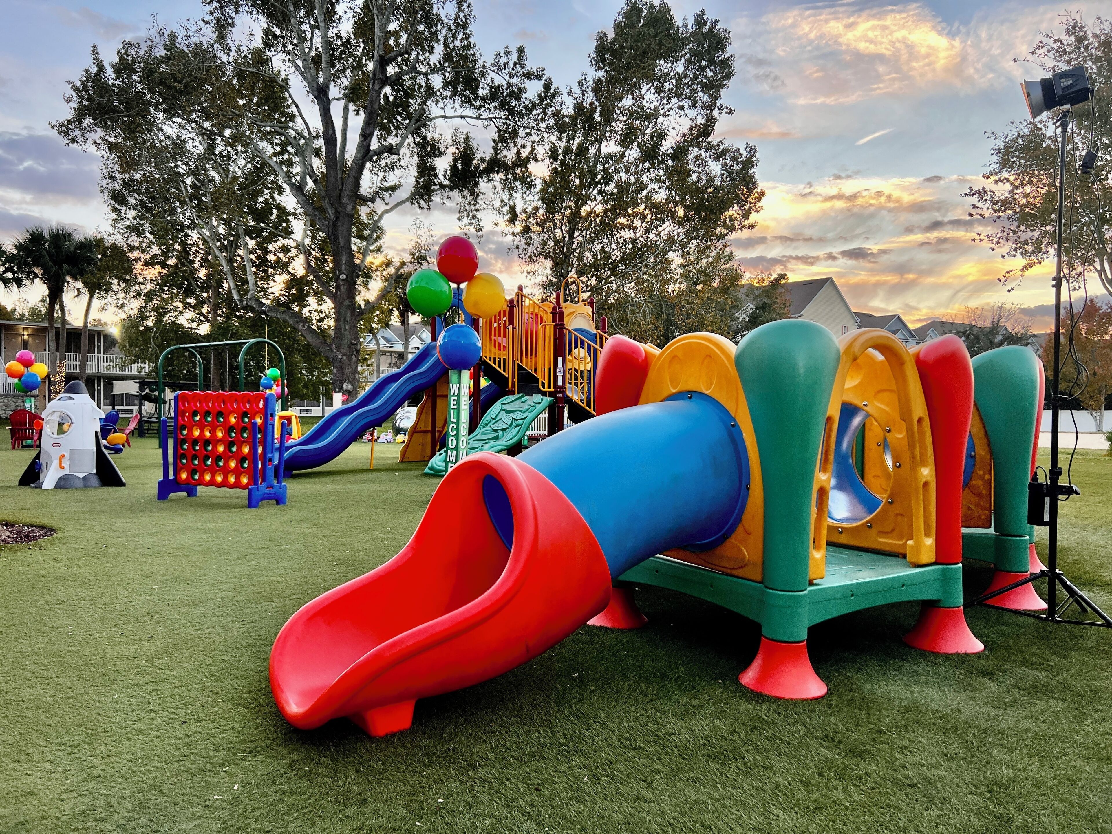 A playground with slides and climbing structures.