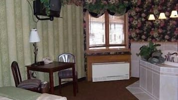 Luxury Suite, 1 King Bed, Jetted Tub | 1 bedroom, iron/ironing board, free WiFi, bed sheets