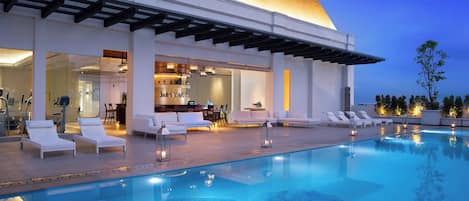 Outdoor pool, open 6:00 AM to 9:00 PM, sun loungers