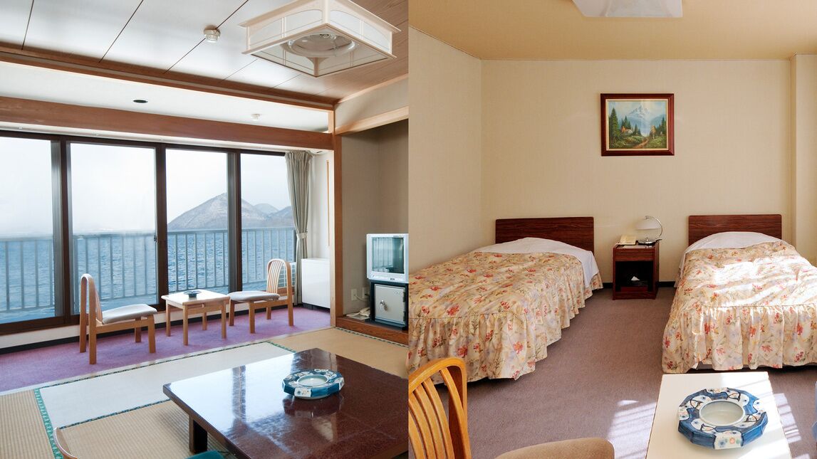 Una habitación con un ventanal grande, una cama, un escritorio y una silla.